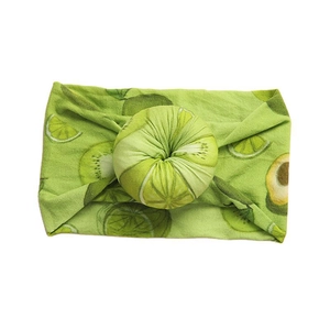 Bohemian style baby donut headband with green lime and avocado fruit patterns