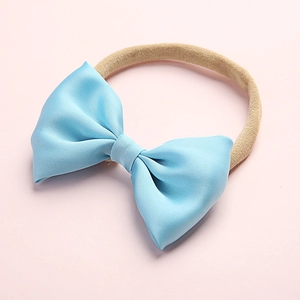Detail of light blue satin bow hairband for infants with high-elastic nylon band