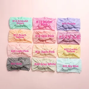 Grille de 12 bandeaux pour bébé à pois en nylon souple avec nœuds de couleurs variées