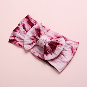 Baby tie-dye nylon headband with a large bow in pink and dark red creative design