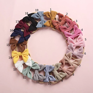 Set of 19 assorted corduroy bow headbands for babies in various Morandi colors