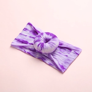 Bohemian purple tie-dye baby nylon headband with 3D donut design on light pink background