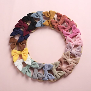 Set of 20 corduroy bow baby headbands in various colors with soft nylon elastic bands