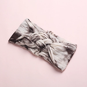 Soft tie-dye wide headband for babies with a stylish braided knot design in coffee brown