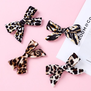 Set of four velvet hair clips for girls featuring leopard and zebra animal patterns