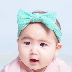 Bandeau bébé vert menthe en maille gaufrée avec grand nœud pour nouveau-né