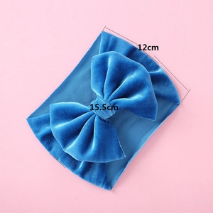 Detailed view of large dark blue velvet bow headband for girls showing 15.5cm width