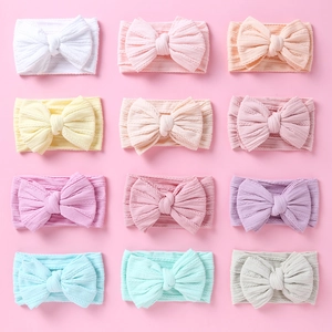 Set de 12 diademas de nailon para bebé con lazos grandes en varios colores pastel