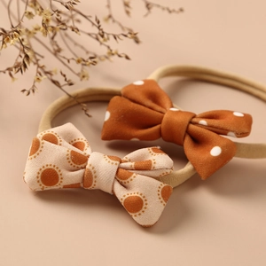 Retro bow headbands set for babies featuring polka dot and circular patterns