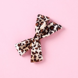 Detailed view of leopard print velvet bow hair clip with high-quality soft texture