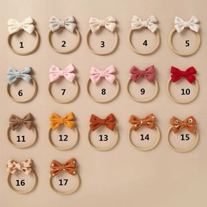 Detailed set of 17 colorful nylon baby headbands with assorted bow patterns and textures