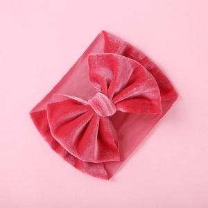 Detail of soft velvet texture and large double-layer bow on baby elastic headband