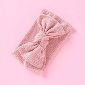Weiches rosa Strickstirnband für Babys mit doppellagiger Schleife und Rippenstruktur