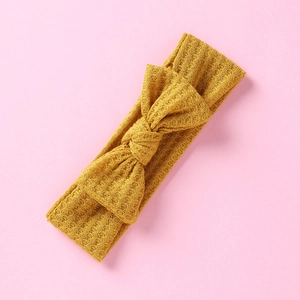 Bandeau bébé jaune gingembre en tricot gaufré avec grand nœud décoratif pour filles