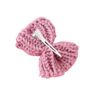 Pink knitted bow hair clip with textured wool braid and durable metal duckbill clip
