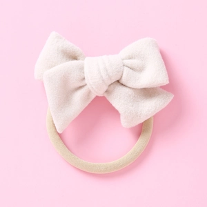 Bandeau bébé en nylon souple avec un nœud en velours crème doux pour nourrissons