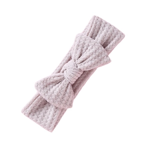 Bandeau bébé rose en tricot gaufré avec un grand nœud décoratif pour nouveau-nés filles