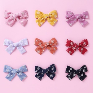 9-piece set of handmade cotton lace bow hair clips with floral embroidery in various colors