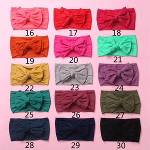 Macro view showing 15 different color options for soft nylon baby bow headbands