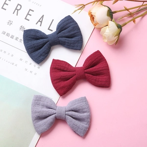 Set di tre fermagli per capelli con fiocco in mussola di cotone nei colori blu e bordeaux