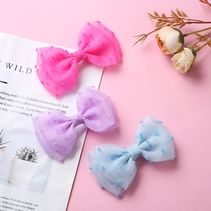 Lot de trois barrettes à nœuds en tulle avec pois en rose, violet et bleu clair