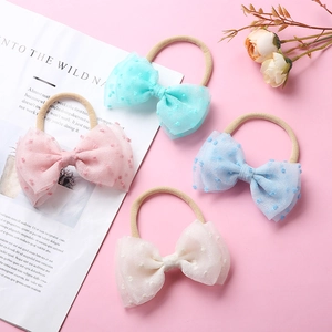 Lot de 4 bandeaux bébé en nylon souple avec nœuds en résille texturée couleurs pastel