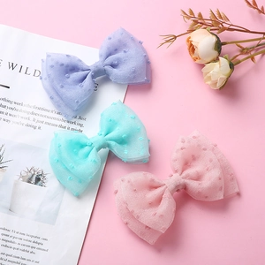 Lot de trois barrettes à nœuds en tulle avec pois en lavande, vert menthe et rose pour filles