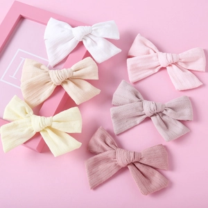 Set di sei fermagli per capelli a fiocco in cotone jacquard in vari colori pastello