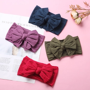 Soft nylon infant headbands set with large double-layered bows in four vibrant colors