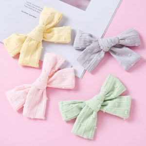Set of four textured jacquard cotton hair bows in pastel yellow, purple, pink and green