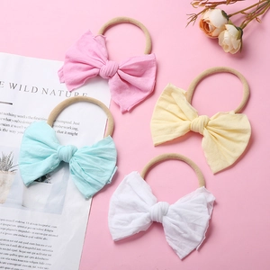 Lot de 4 bandeaux bébé en nylon souple avec grands nœuds en tissu de couleurs pastel