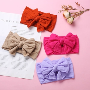 Set of four soft nylon baby headbands with large double layer swallowtail bows