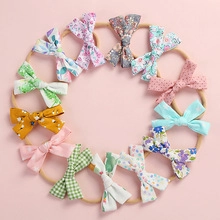 Lot de 12 bandeaux bébé avec nœuds en texture gaufre et divers motifs colorés