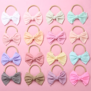 Lot de 16 bandeaux pour bébé en nylon doux avec grands nœuds aux tons pastel et terre