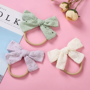 Three-piece set of soft cotton floral lace bow headbands for infants in pastel colors