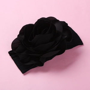 Detail of soft nylon headband featuring a large layered 3D black chiffon rose flower