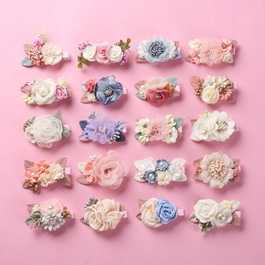 Detail of 20pcs set floral pearl hair clips with fabric wrapped design for girls
