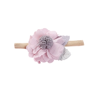 Pink fabric flower baby headband with grey pom-pom center and soft nude nylon elastic band
