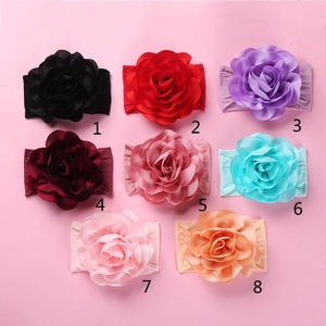 Detailed collection of eight large handmade satin rose headbands for infants in varied colors