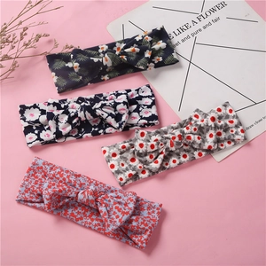 Lot de quatre bandeaux en coton extensible pour bébé avec motifs floraux et nœuds