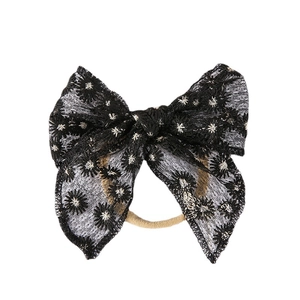 Bandeau bébé avec nœud en dentelle noire, broderie de marguerites et ruban en nylon souple