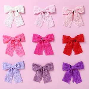 Detail view of 9-color lace bow headband set with floral embroidery for baby girls