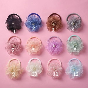 Detailed set of 12 chiffon flower headbands for girls with soft nylon bands in varied colors