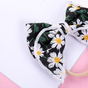 Embroidered daisy floral bow headband for kids made with soft seamless nylon fabric
