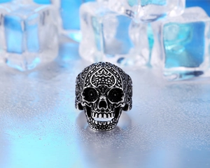 Detailed view of skull ring with vintage steel texture and gothic engravings