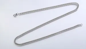 Close-up of polished stainless steel flat curb chain necklace with a lobster clasp