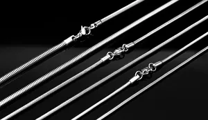 Macro shot of silver round snake chains in five thicknesses with lobster clasps