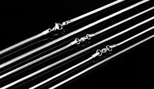 Macro shot of silver stainless steel snake chains in five widths with lobster clasps