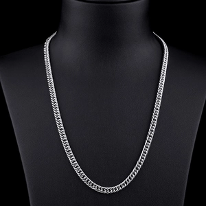 Polished silver stainless steel flat Cuban link chain necklace for men on black display