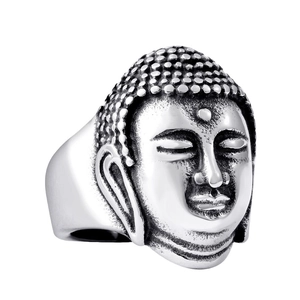 Religious Buddha head ring in vintage stainless steel with detailed carvings on white background
